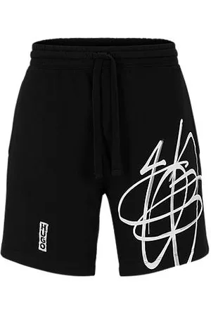 HUGO BOSS Miehet Shortsit - Relaxed-fit cotton shorts with graffiti-inspired logo