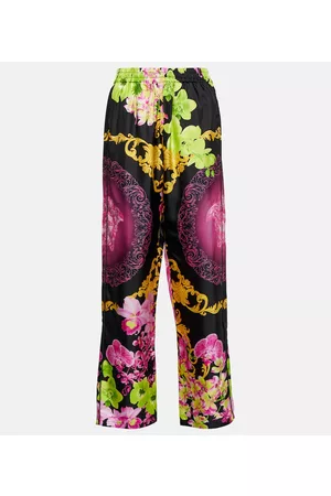 VERSACE Naiset Leveälahkeiset - Printed silk high-rise pants